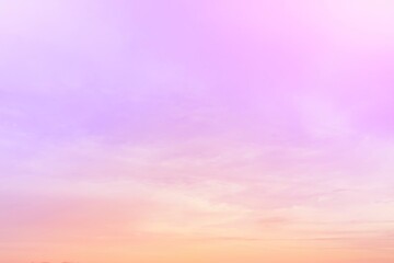 The subtlety of the soft faded clouds  On the background of the twilight sky, pastel gradients  Beautiful combinations of yellow, pink, orange, red, purple and blue.