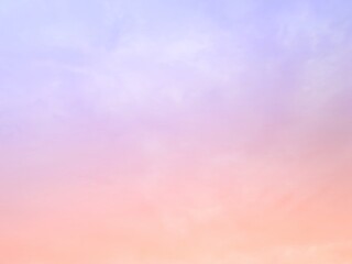 The subtlety of the soft faded clouds  On the background of the twilight sky, pastel gradients  Beautiful combinations of yellow, pink, orange, red, purple and blue.