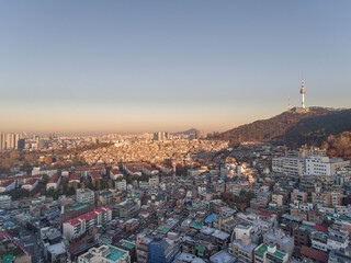 Sunset Seoul Cityscape and Namsan Mountain Park in Background. South Korea. Aerial, Skyline of City