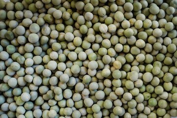 Dry green peas background, selective focus