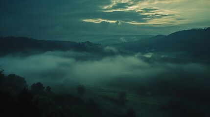 Fototapeta na wymiar Misty Dawn in the Valley: Ethereal and Mysterious Landscape