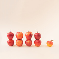 Summer fresh raw apple set on light pastel cream background. Minimal layout aesthetic.