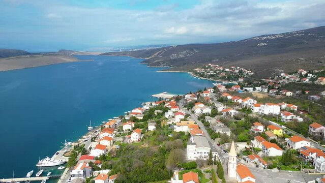 Experience the tranquility and beauty of Jadranovo, a charming coastal village nestled along the picturesque Adriatic coast of Croatia captured from a drone