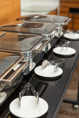 Row of closed chafing dishes