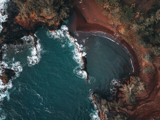 Hawaii red sand beach from a drone