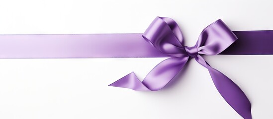 Purple ribbon on white gift box with bow
