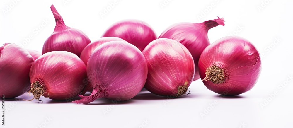 Poster Group of red onions on a white surface