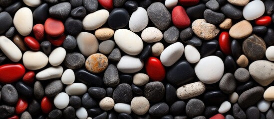 Close-up of a mix of black, white, and red stones