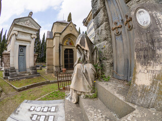 FLORENCE, ITALY - MARCH 23 2024: The monumental Cemetery of the "Porte Sante" next to the Basilica of San Miniato al Monte (St. Minias on the Mountain), in Florence, Tuscany, Italy.