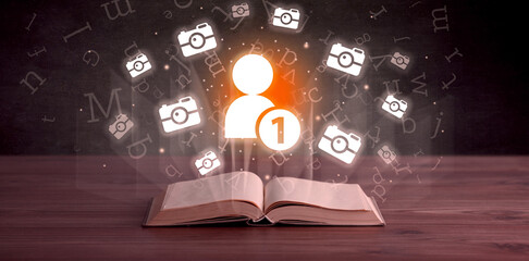 Open book with social networking icons above - 767242364