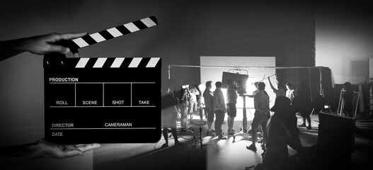 Manipulation images of Movie slate and video production of making of TV commercial movie shoot that...