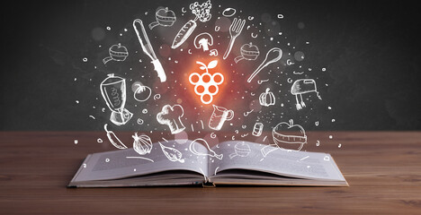 Open recipe book with food related icons above - 767244974