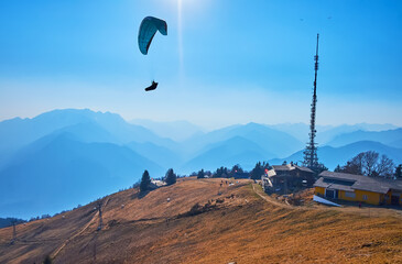 The glider aircraft over Cimetta Mountain cable car station, Ticino, Switzerland