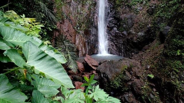Tripod footage of Air Terjun Jagasatru waterfall on cloudy day. Bali, Indonesia.