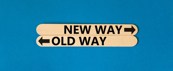 New or old way symbol. Concept word New way Old way on beautiful wooden stick. Beautiful blue table blue background. Business and new or old way concept. Copy space.