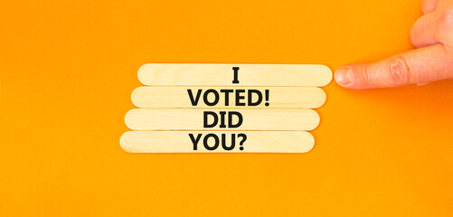 I voted. Did you symbol. Concept words I voted. Did you on wooden stick. Beautiful orange table...