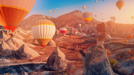 Landscape sunset in Cappadocia with set colorful hot air balloon fly in sky with sunlight. Concept...