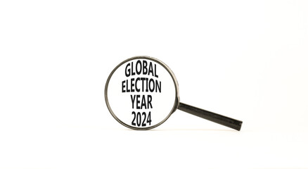 Global election year 2024 symbol. Concept words Global election year 2024 on beautiful magnifying glass. Beautiful white table white background. Business Global election year 2024 concept. Copy space