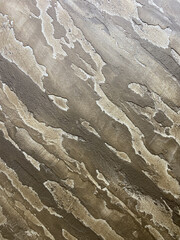 Textured colored plaster, can be used for the background. It has a pronounced structure