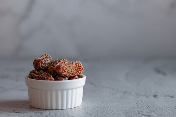 View of the sweet dry dates which provides essential nutrients. Dry dates in a bowl.