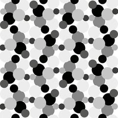 Seamless vector pattern with black and white polka dots in an unusual patterned interpretation
