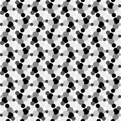 Seamless vector pattern with black and white polka dots in an unusual patterned interpretation