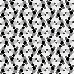 Seamless vector pattern with black and white polka dots in an unusual patterned interpretation