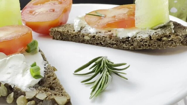 Sandwiches with cottage cheese and cucumber slices, cherry tomatoes on firewood. The concept of dietary nutrition.