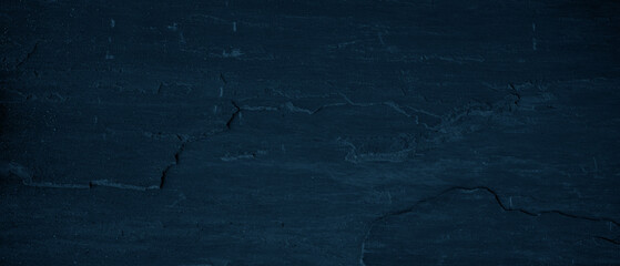 Dark blue stone concrete texture background panorama banner long, with space for text.