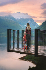 Tourists mother and daughter on Bergsbotn viewpoint - family vacations in Norway travel lifestyle outdoor, parent and child exploring Senja island sunset landscape mountains and sea - 767288959