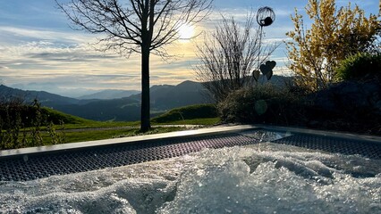 Hot tub with a view of the mountains at sunset
