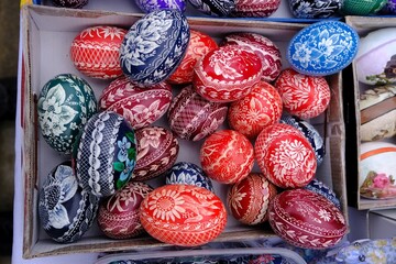 Beautiful handmade colorful Easter eggs in a basket. Kurpie, Poland