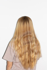 young woman with long blonde wavey hair
