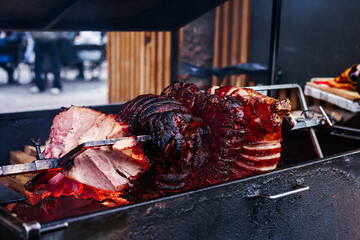 Street food, Czech republic Traditional cuisine Smoke Ham. Close up Slow cook Roasted pork ham over...