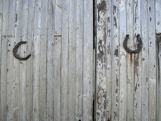 Horseshoe on an old wooden barn door - Portsoy - Aberdeenshire - Scotland - UK