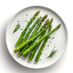 Simple green asparagus salad on a flat ceramic plate, garnished with sea salt and rosemary. Top view, isolated on white background. Elegant plating. Healthy food.