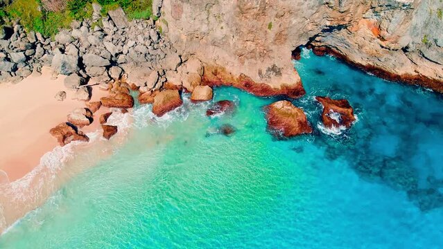 Dominican sandy beach and turquoise sea. Top view of the lagoon near the seashore. Landscape of a tropical island paradise. Summer sunny morning on the rocky ocean coast. Rainbow sea wave on sand.