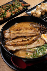 Table with ramen soup and starter fried tofu