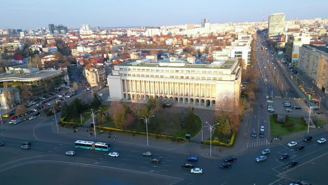 Aerial drone shot of Piața Victoriei in Bucharest - Romania. High angle footage of the infamous square in the capital of Romania with Victoria Palace and the Secretariat General of the government.
