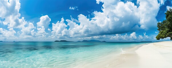 Beautiful beach with turquoise water and white clouds in the blue sky