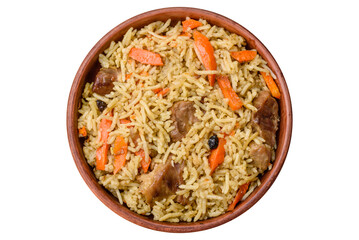 Delicious pilaf with vegetables, salt, spices and herbs in a ceramic plate - 767324702