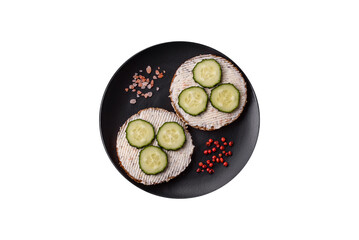 Delicious vegetarian sandwich with grilled toast, cream cheese, cucumbers and seeds - 767324745