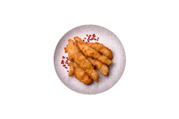Delicious fresh chicken or turkey strips or nuggets breaded with salt and spices