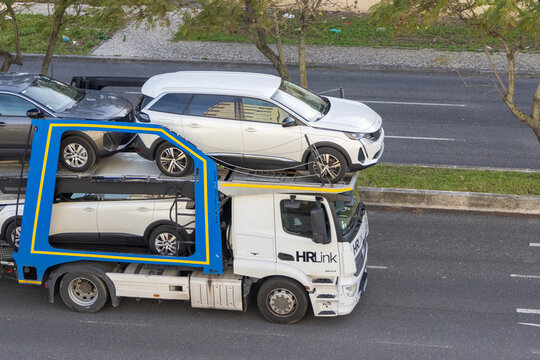 Lisbon, Portugal, March 12, 2024, aerial view, semi-trailer vehicle from the company HR Link, Car Transport, Lisbon