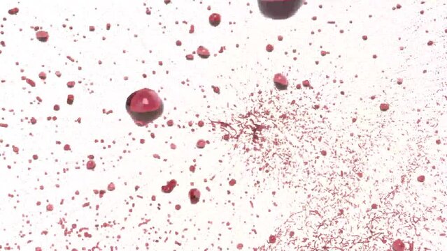 A bullet hits a drop of red liquid and many drops 