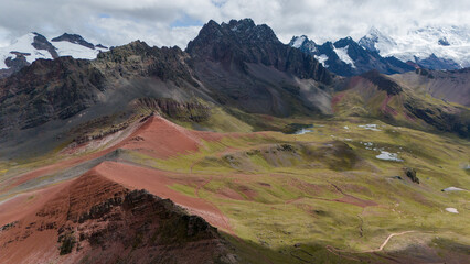 Aerial Drone view of Vinicunca Winikunka Montaña de Siete Colores Rainbow Mountain Andes Mountains Peru