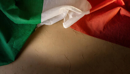Italian flag waving in the wind on a concrete wall background with copy space