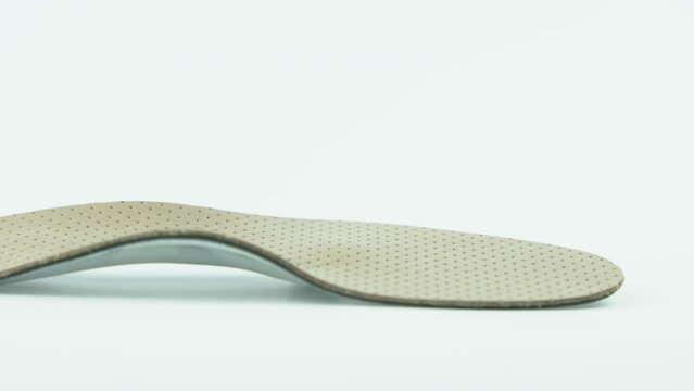 Orthopedic insole isolated on white background. Treatment and prevention of foot diseases