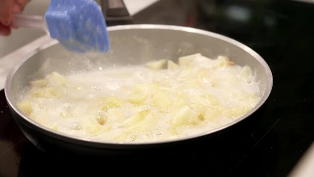 cooking apples in a pan for apple pie
