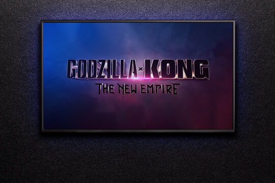 Godzilla x Kong The New Empire trailer or movie on TV screen. TV on black textured wall. Astana, Kazakhstan - March 22, 2024.